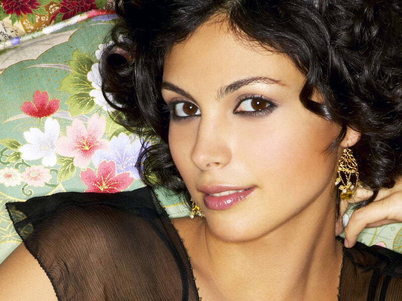 woman with dark hair and earrings
