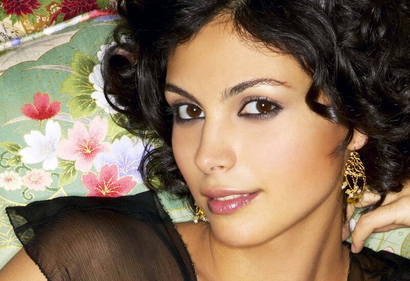 woman with dark hair and earrings