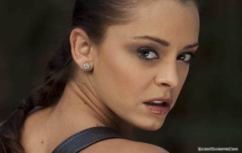 woman with dark hair and earrings