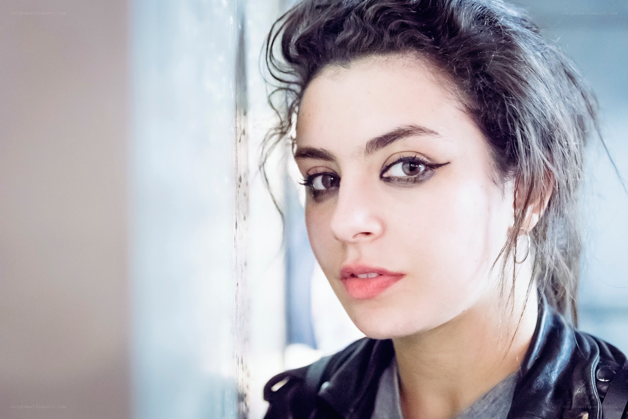 woman with dark hair and eyeliner