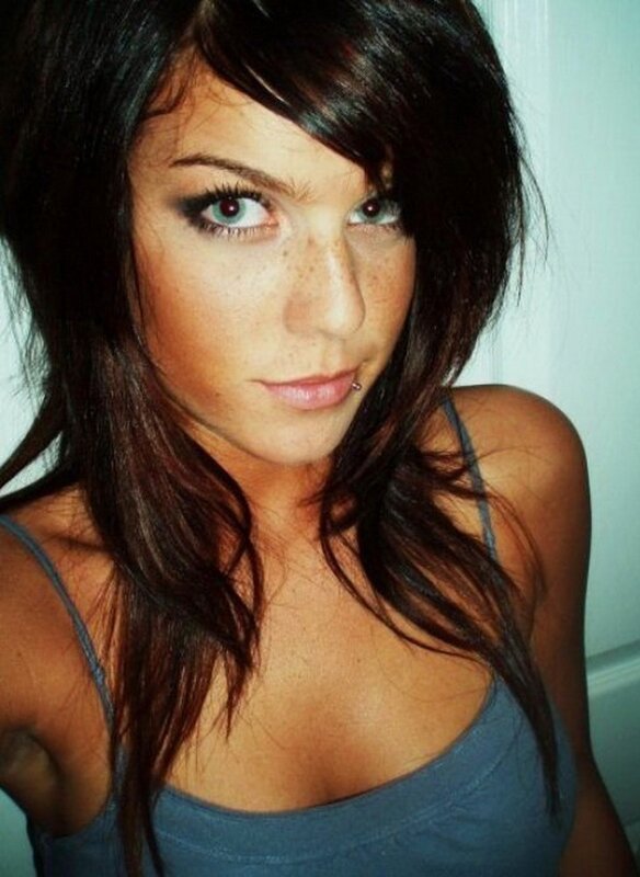 woman with dark hair and freckles
