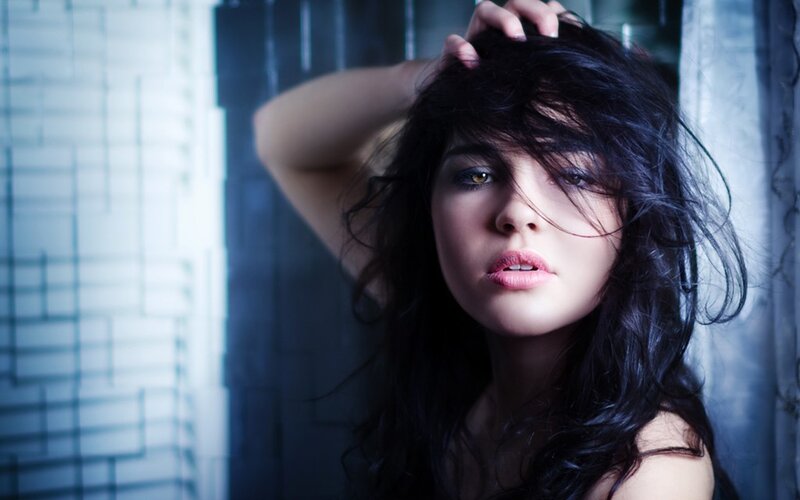 woman with dark hair and golden eyes