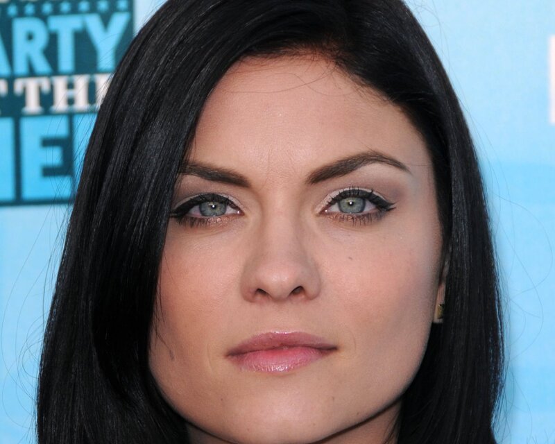 woman with dark hair and green eyes