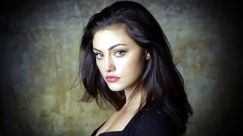 woman with dark hair and green eyes