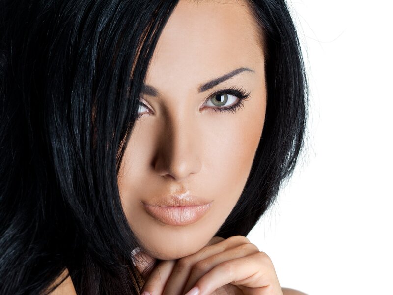 woman with dark hair and green eyes