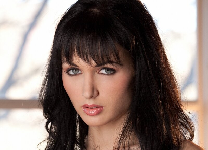 woman with dark hair and green eyes
