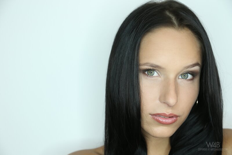 woman with dark hair and green eyes