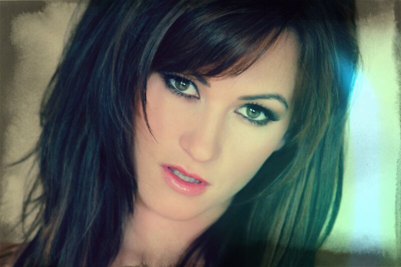 woman with dark hair and green eyes
