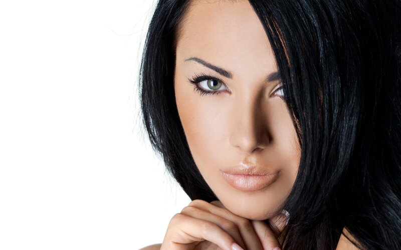 woman with dark hair and green eyes