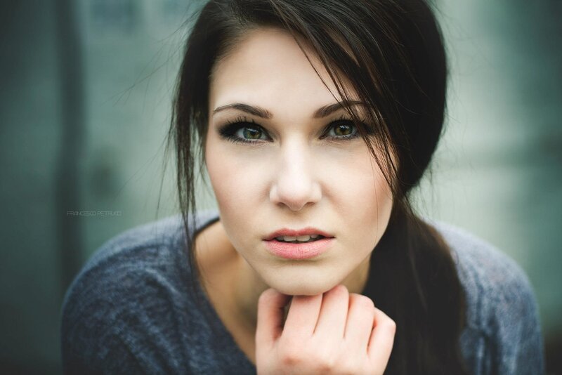 woman with dark hair and green eyes