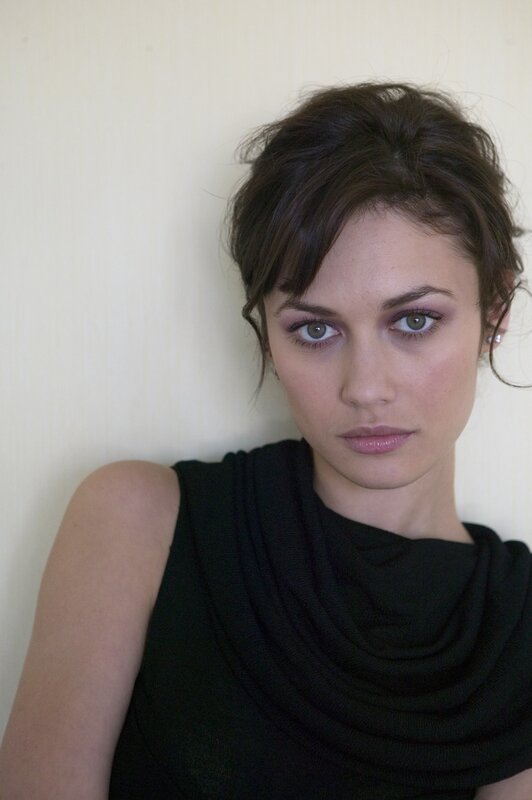 woman with dark hair and green eyes