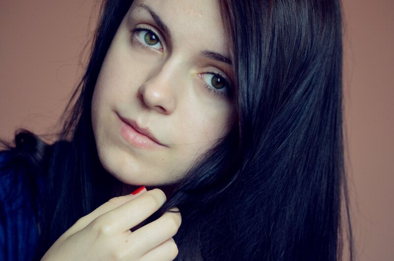 woman with dark hair and green eyes