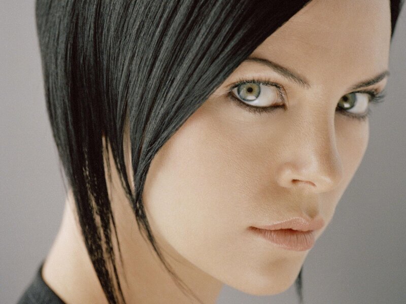 woman with dark hair and green eyes