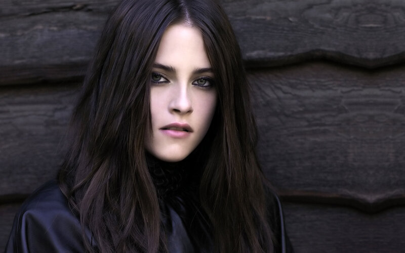 woman with dark hair and green eyes