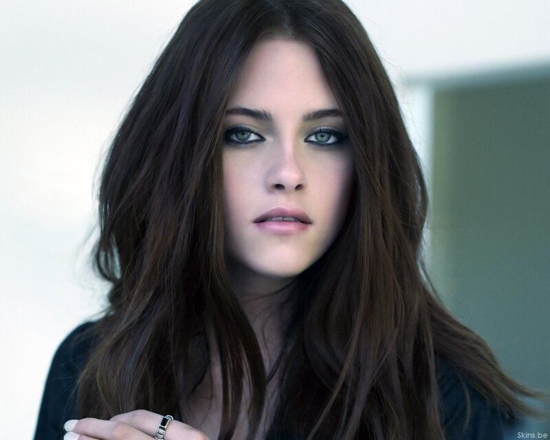woman with dark hair and green eyes