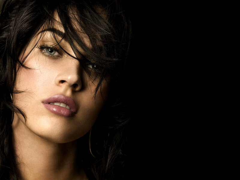 woman with dark hair and green eyes