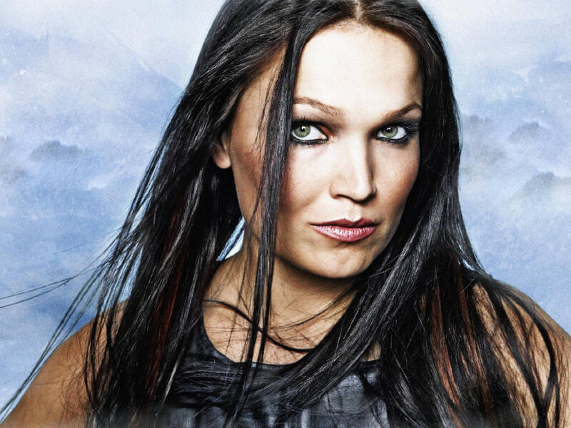 woman with dark hair and green eyes