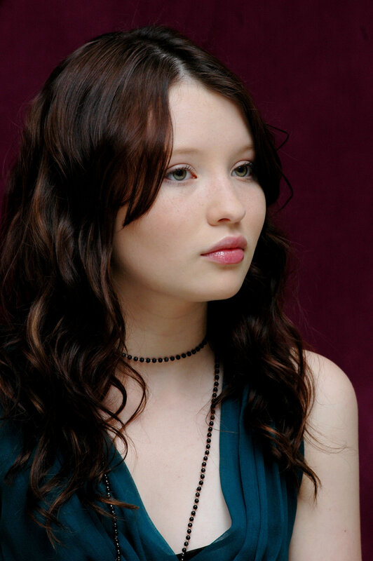 woman with dark hair and green eyes