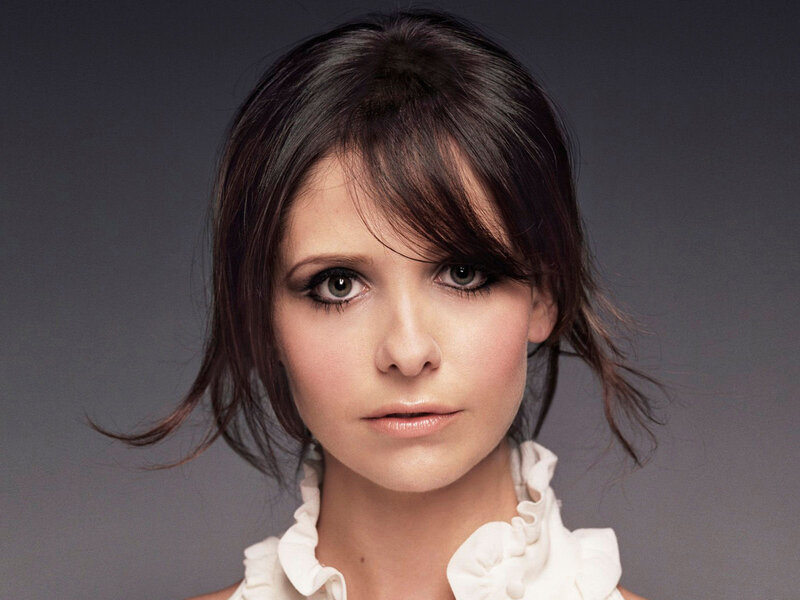 woman with dark hair and green eyes