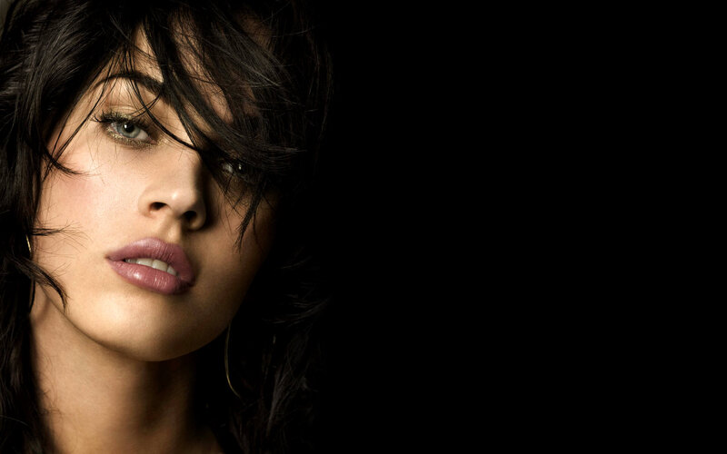 woman with dark hair and green eyes