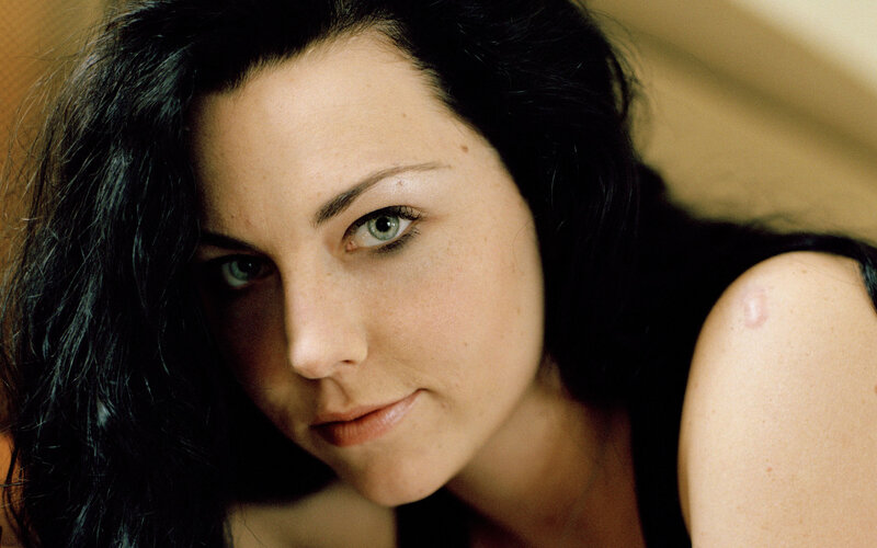 woman with dark hair and green eyes