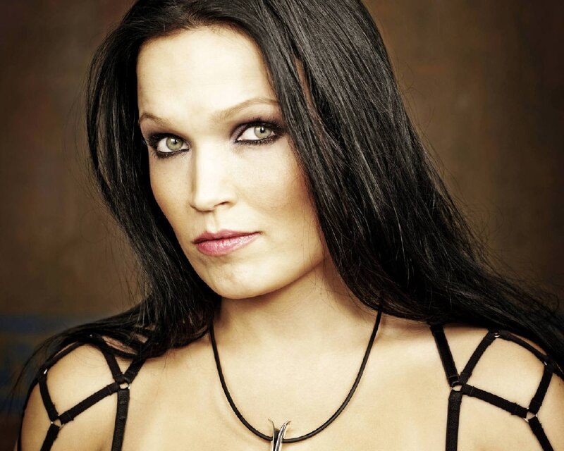 woman with dark hair and green eyes