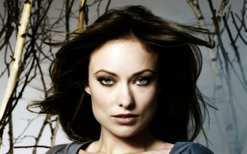 woman with dark hair and green eyes