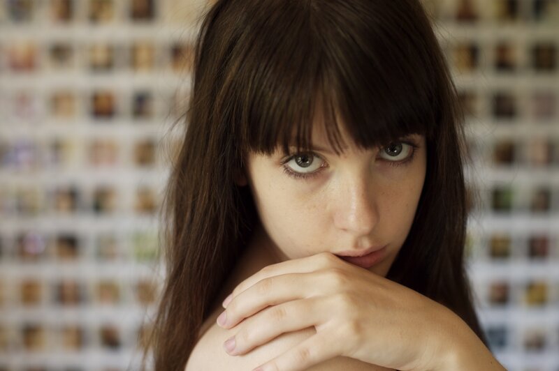 woman with dark hair and green eyes