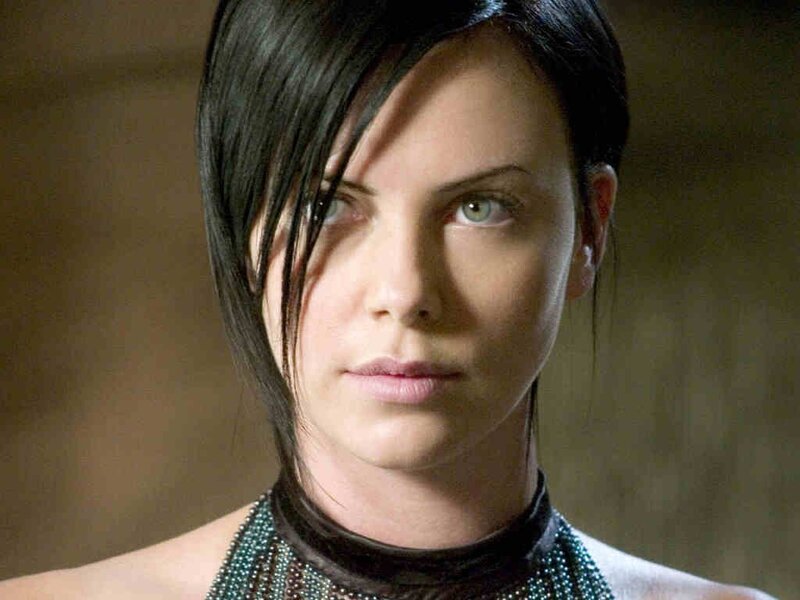 woman with dark hair and green eyes