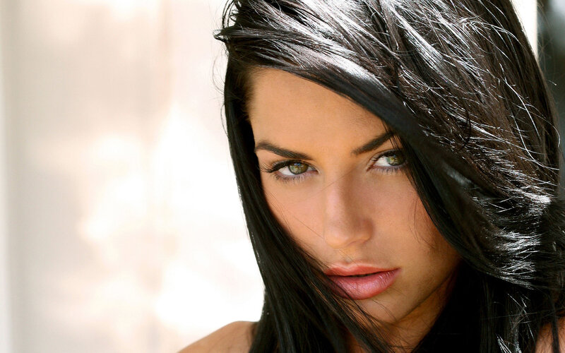 woman with dark hair and green eyes