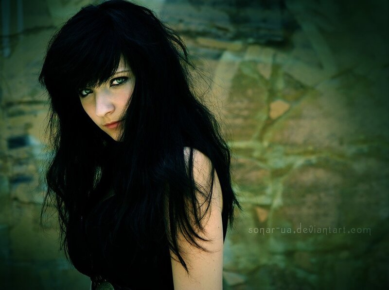 woman with dark hair and green eyes