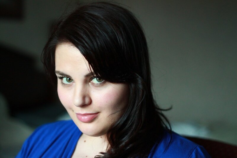 woman with dark hair and green eyes