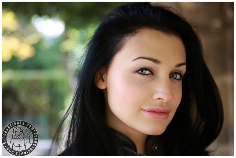 woman with dark hair and green eyes