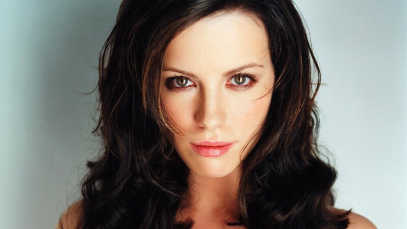 woman with dark hair and green eyes