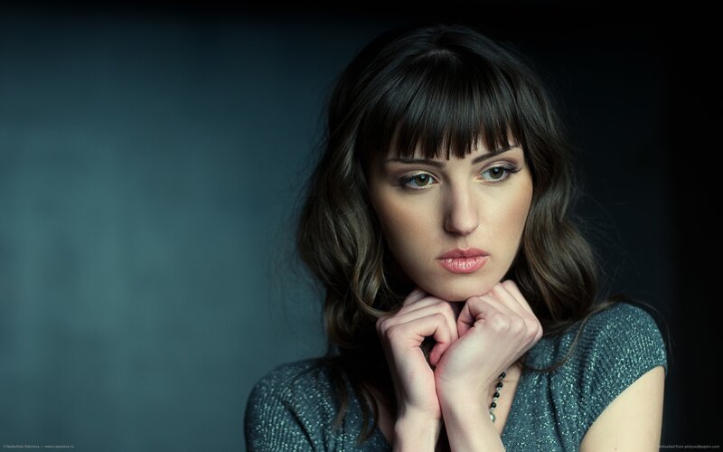 woman with dark hair and green eyes