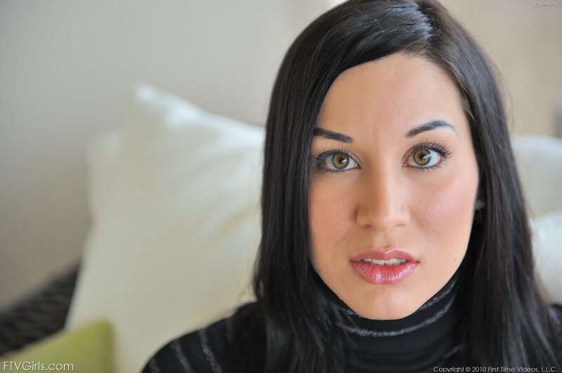 woman with dark hair and green eyes