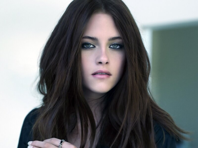 woman with dark hair and green eyes
