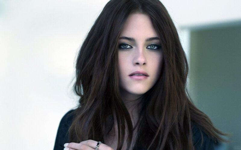 woman with dark hair and green eyes