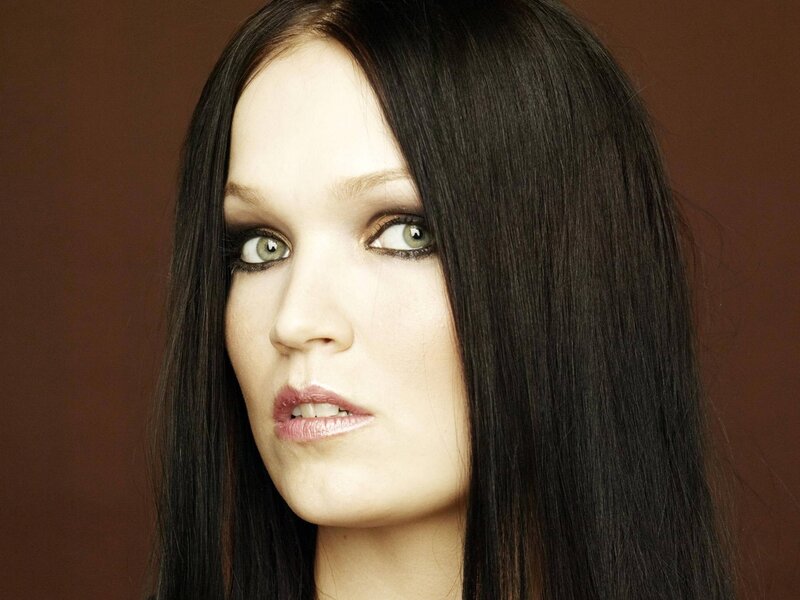 woman with dark hair and green eyes