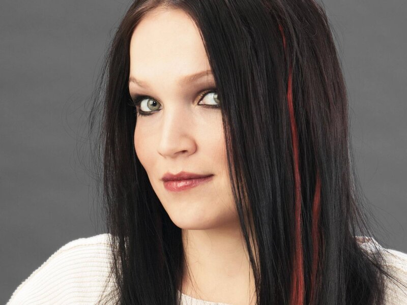 woman with dark hair and green eyes