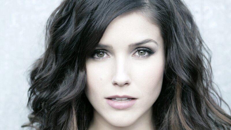 woman with dark hair and green eyes