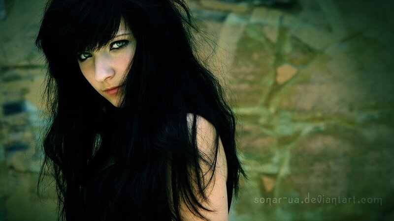 woman with dark hair and green eyes