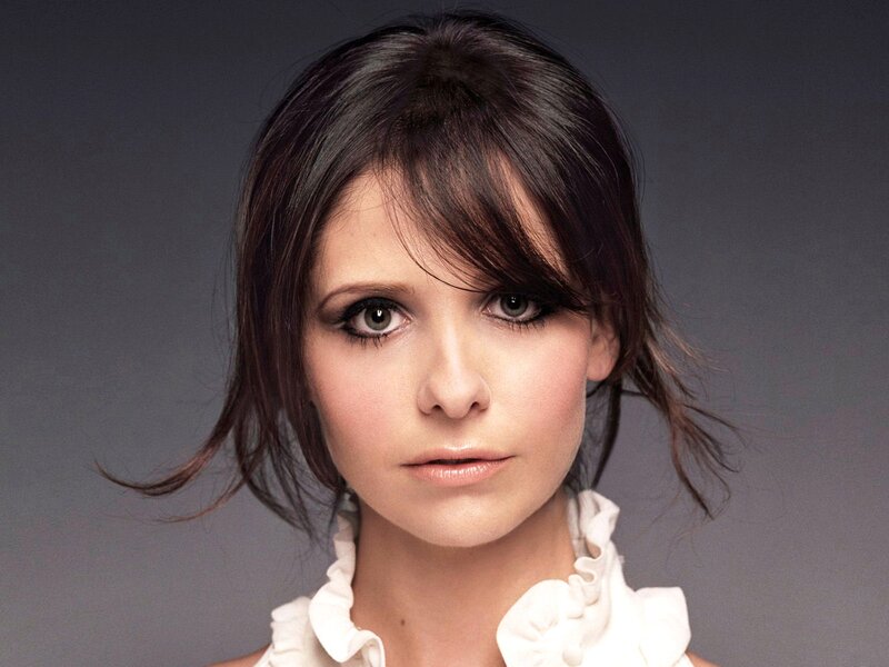 woman with dark hair and green eyes