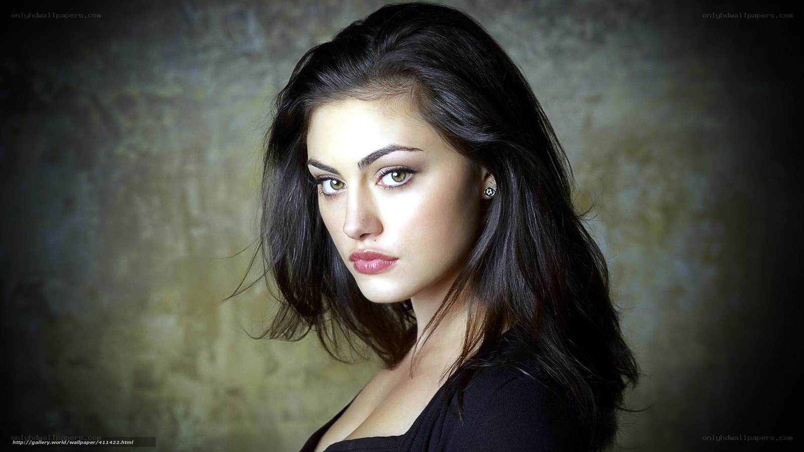 woman with dark hair and green eyes