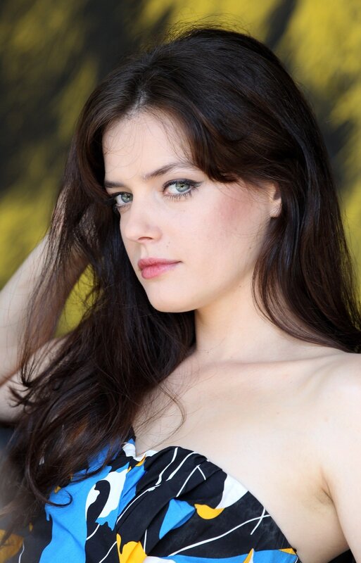 woman with dark hair and green eyes