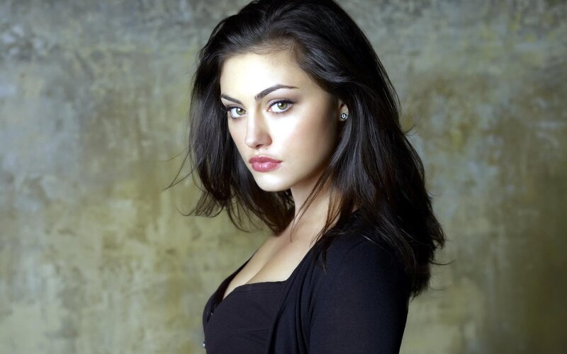 woman with dark hair and green eyes