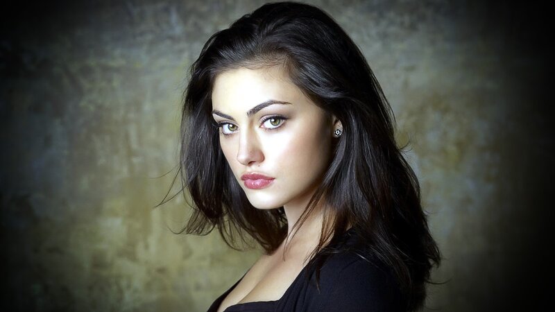 woman with dark hair and green eyes