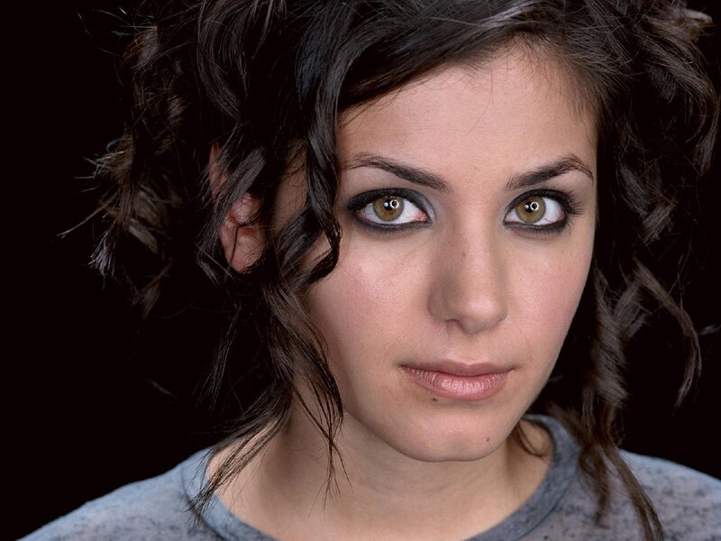 woman with dark hair and green eyes