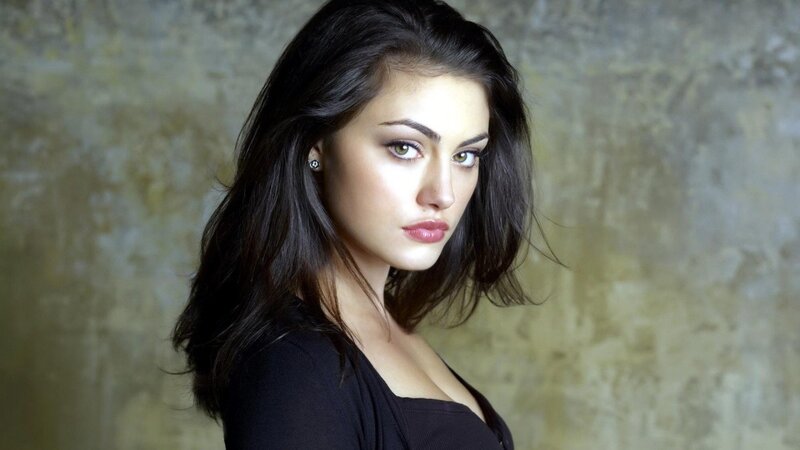 woman with dark hair and green eyes