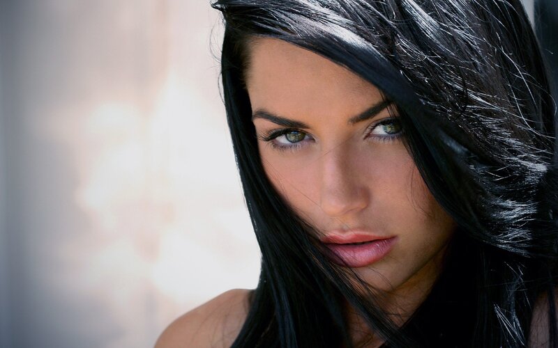 woman with dark hair and green eyes